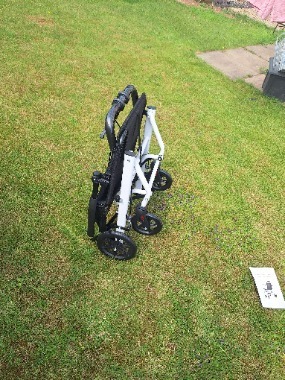 White collapsible travel wheel chair 