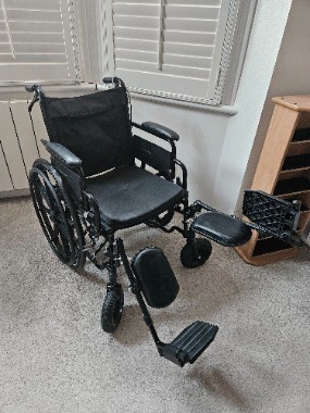 Wheelchair with elevated leg rests