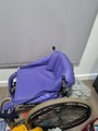 Purple self propelled wheel chair