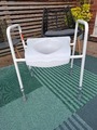 Adjustable raised toilet seat with handles image