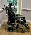 Breezy Ibis push wheelchair fitted with the Sedeo Pro seating system