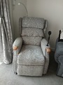 electricty  recliner chair   has wheels and a fan and light and massarges