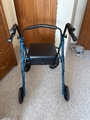 Four wheeled Alerta rollator with seat and solid back