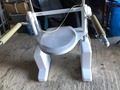 Electric rising toilet seat