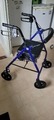 Blue rollator/ walker with seat