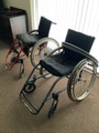 Lightweight rigid frame wheelchair