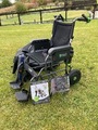 Electric carer controlled wheelchair